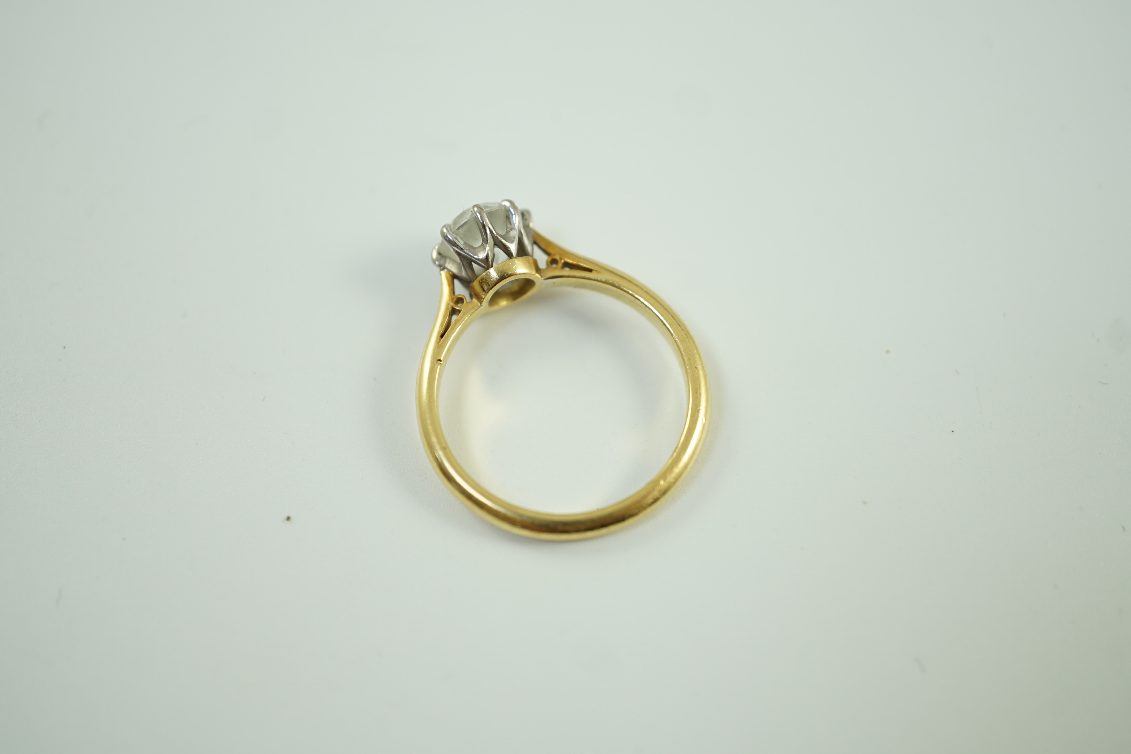 An 18ct, plat and single stone white zircon? set ring, size R, gross weight 4.8 grams.